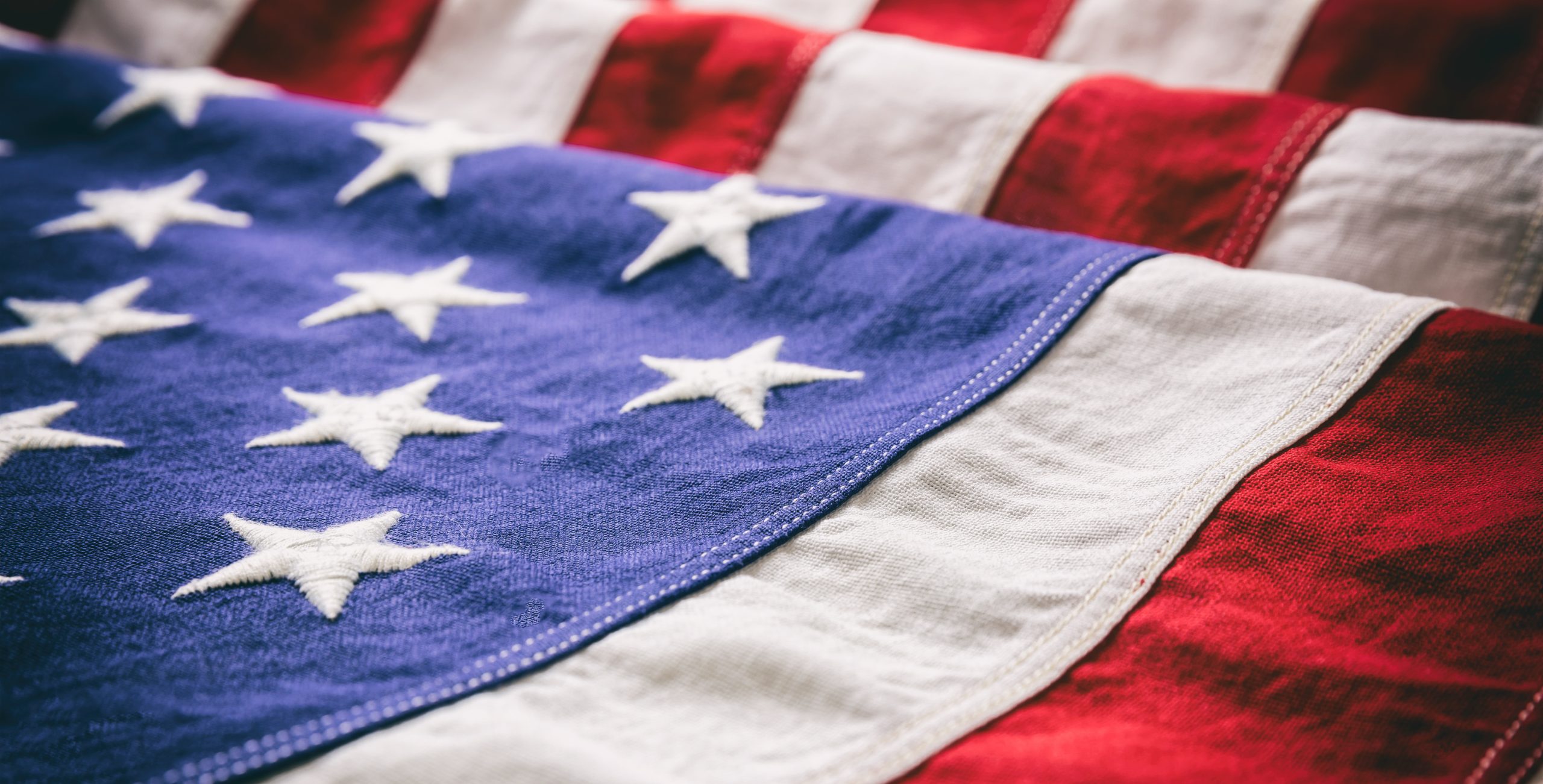 USA flag, US of America sign symbol background, closeup view USA flag detail, closeup view. American flag background texture.